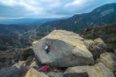 Niko on another first ascent of a problem on a set of large boulders above Highway 33