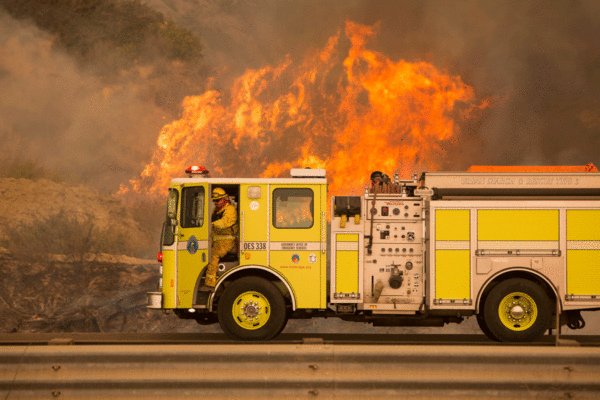 A Governor’s Office of Emergency Services firetruck pulls up to a blaze adjacent to the 101 freeway near Highway 150 on Dec 6. Photo by Logan Hall.