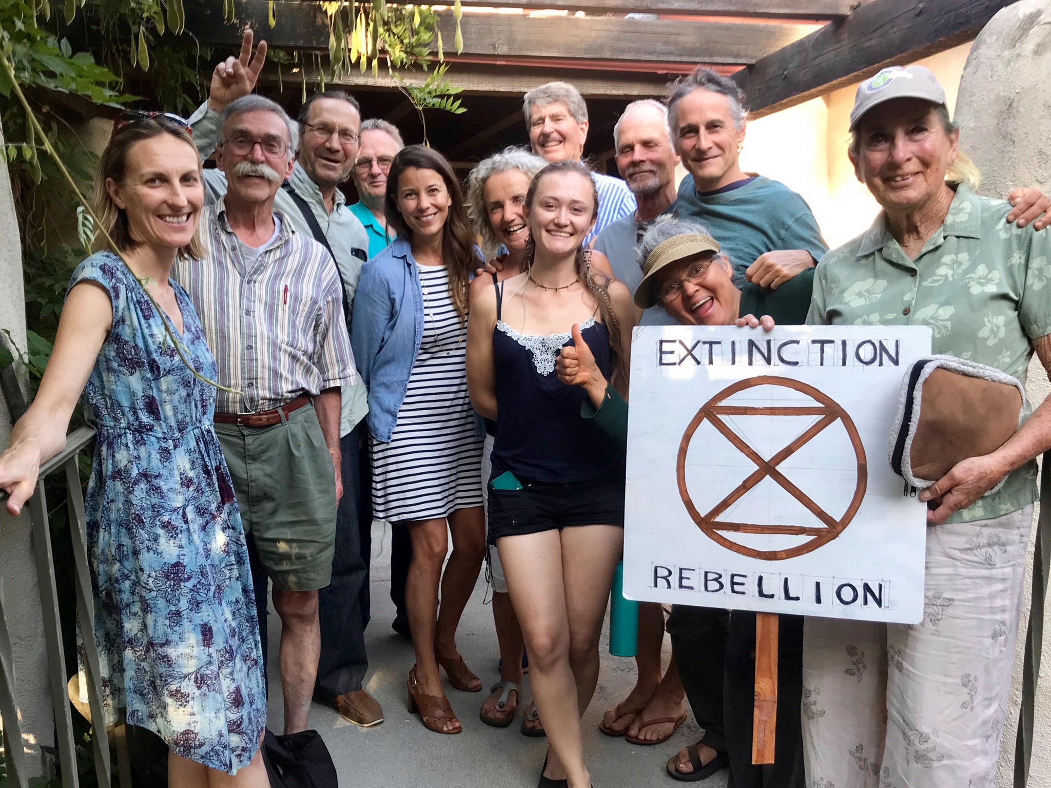 A group of Ojai activists celebrate the passage of a climate emergency resolution by the Ojai City Council